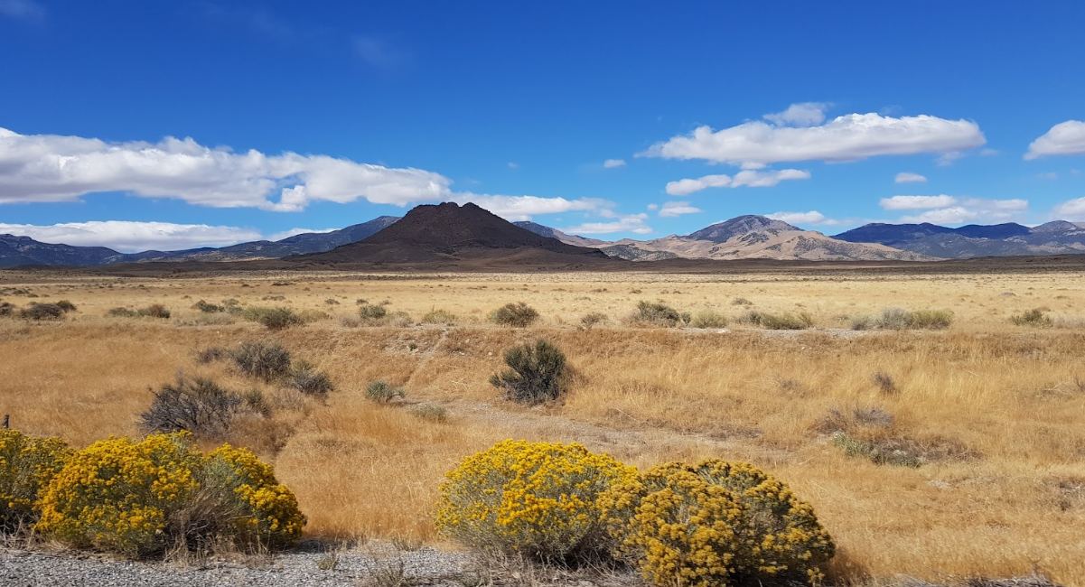 High desert land with mountains in the distance